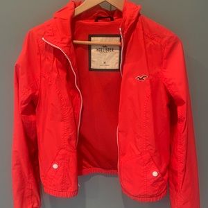 Girls Hollister red rain jacket w/hood.sz m